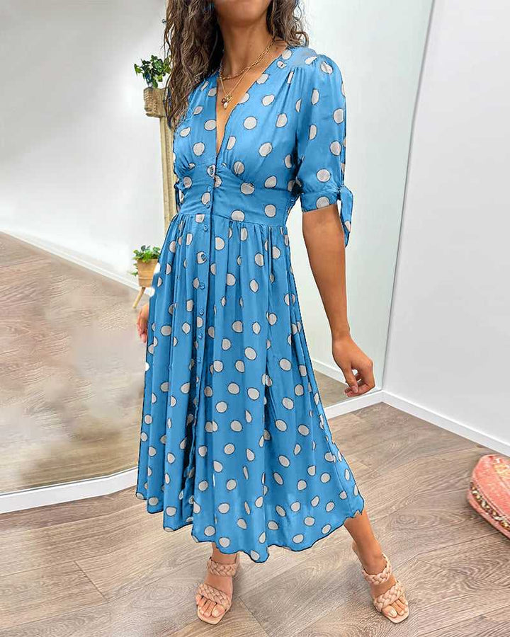 ANKA | Polka dot dress with flared hem and accentuated waist