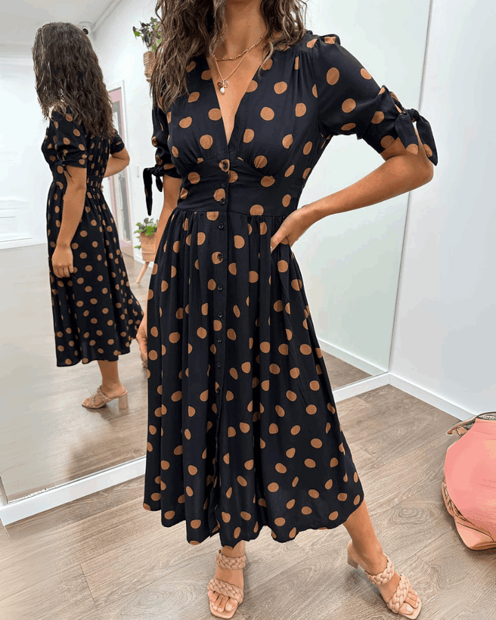 ANKA | Polka dot dress with flared hem and accentuated waist